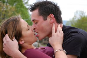 man being seduced by woman wearing pheromone spray